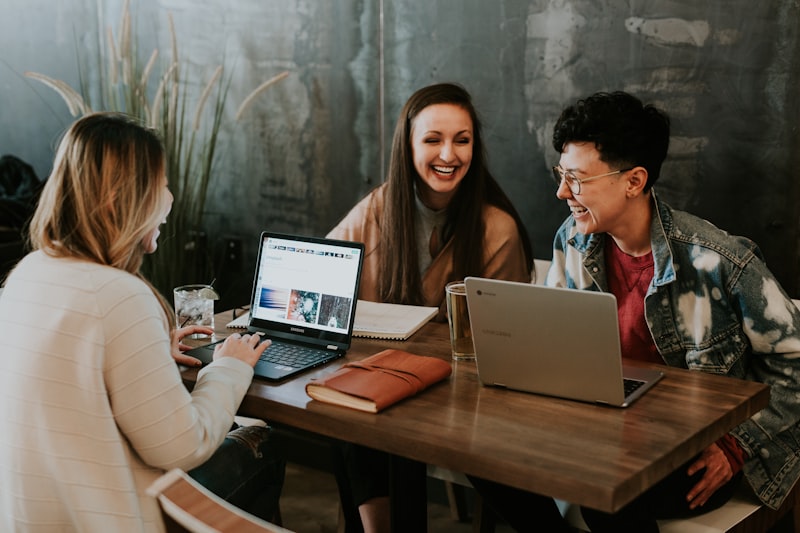 Consultants collaborating over a laptop